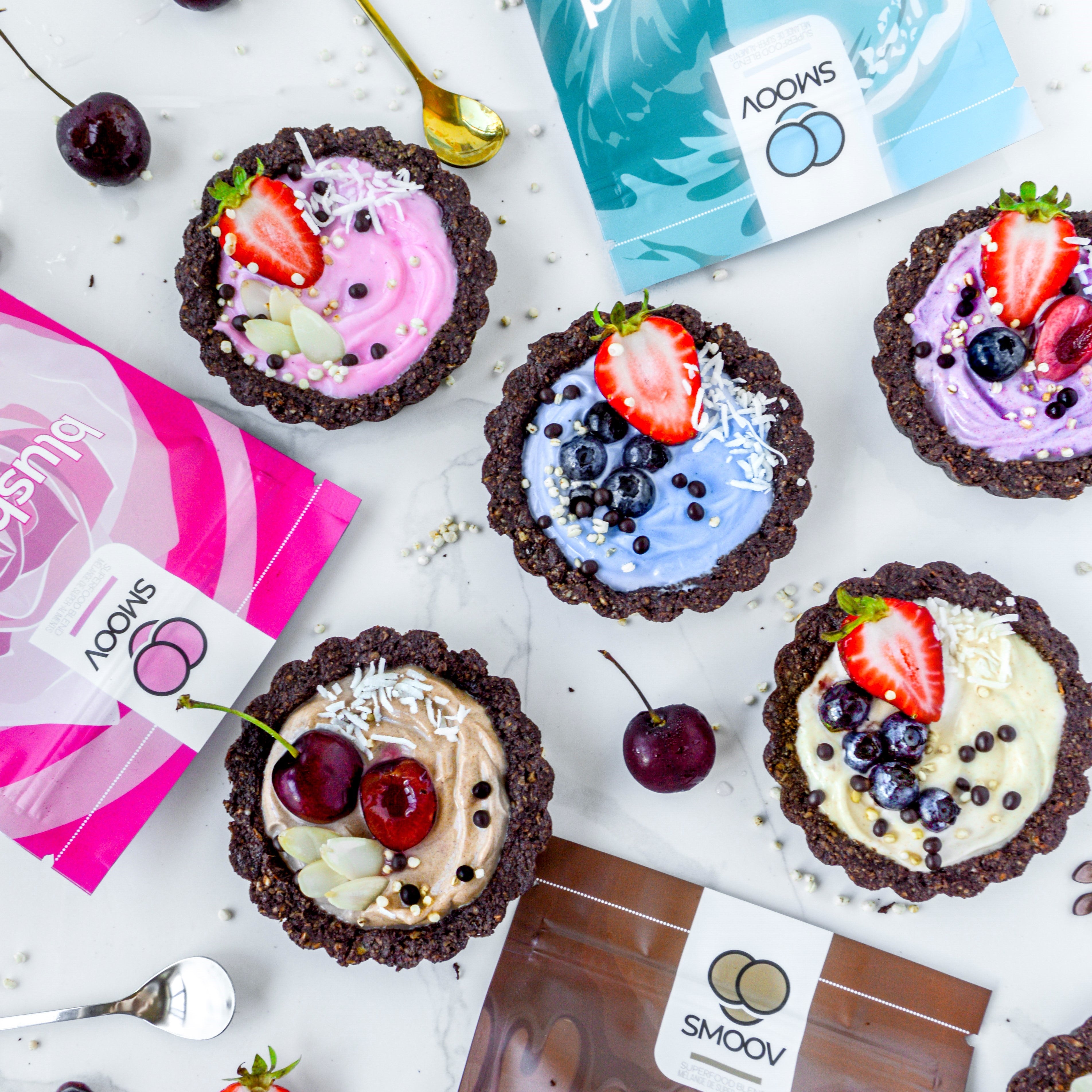 These SMOOV superfood mini tarts are perfect for breakfast or dessert! They have a chewy brownie like crust and filled with Greek vanilla yogurt.